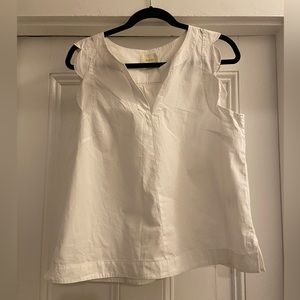 White cotton sleeveless shirt.